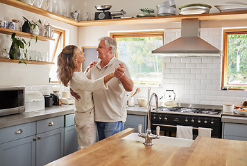 Image showing Dance, couple and kitchen with a senior man and woman dancing together in a retirement home. Love, freedom and romance with an elderly male and female pensioner having fun in a house in the morning