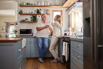 Image showing Relax, coffee and elderly couple in a kitchen, bonding and talking in their home together. Love, woman and mature man enjoying retirement and relationship indoors, casual conversation in the morning