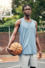 Image showing Basketball player, black man portrait and outdoor sports court training, workout and game in New York, USA. Young athlete playing ball in community playground, urban action and competition with focus