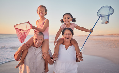 Image showing Children, grandparents and fishing with a family on the beach during summer for holiday, vacation or travel. Kids, happy and ocean with a senior man, woman and their grandkids by the sea at sunset