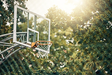 Image showing Nature, basketball court and basket for fitness training and game tournament score exercise. Outdoor sports venue net for competition goal practice and cardio workout with sunshine flare.
