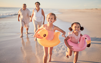 Image showing Beach walk, family summer and children running with grandparents while walking by the sea on holiday. Senior couple, girl kids and walking by the ocean on travel vacation in Hawaii during sunset