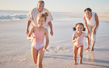 Image showing Beach, girl children and grandparents running on sand ocean in summer for healthy body, outdoor wellness and growth development. Happy family with love, support and care for kids having fun in sea