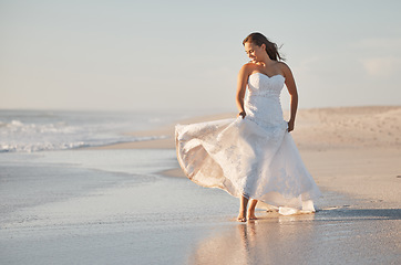 Image showing Bride walking on beach sand in wedding dress, summer event and tropical sunshine location outdoors. Happy, smile and luxury beauty woman celebrate love, marriage celebration and freedom by ocean sea