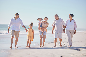 Image showing Family, love and beach with a girl, grandparents and parents walking on the sand with a view of the sea or ocean and sky. Love, travel and summer with a man, woman and daughter happy on vacation