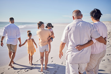 Image showing Big family at beach, relax on summer vacation with grandparents and kids at the sea. Retirement time together, quality travel in the sun and enjoy a holiday by the ocean. Sand, sunshine and fresh air