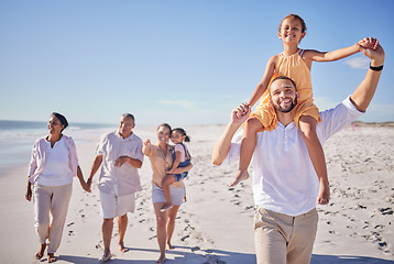 Image showing Beach, family and father with daughter on back and grandparents walk on sand to relax, bonding and fun. Happy, parents and kids being playful, smile and enjoy the sunny day in summer on a vacation.