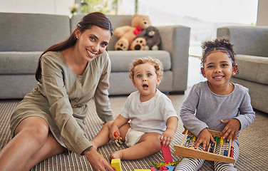 Image showing Mother, baby and child on carpet for education, learning and teaching in their living room home with happy portrait. Young mom from Mexico with kids play time, mindset growth development with puzzle
