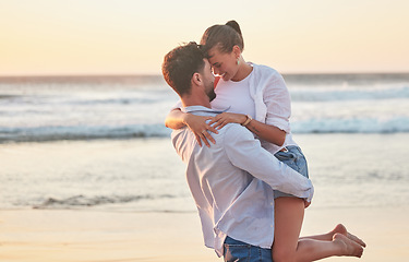 Image showing Couple, love and beach with a man and woman by the sea or ocean during a summer vacation. Water, nature and travel with a young male and female bonding or dating for romance together on the coast