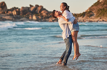 Image showing Couple lift and hug at beach celebrate dating love, care and trust on ocean summer travel or Bali vacation. Excited man and woman happy, smile and happiness together enjoy romantic Hawaii sea holiday