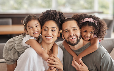 Image showing Portrait of family, smile and love while relax together on a sofa at home. Carefree playful little children or girl hug arms around loving parent. Happy kids bonding with mom and dad on sofa or couch