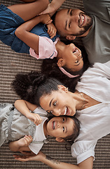 Image showing Love, above and happy relax family having fun, bond or enjoy quality time together in home living room. Smile, laugh and happiness for youth kids or children with mom, dad or parents on the floor