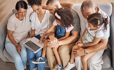 Image showing Top view, laptop and family watch cartoon movies or streaming online in the living room on a sofa. Diverse senior people, with parents and grandchildren on couch in family home enjoy slideshow.