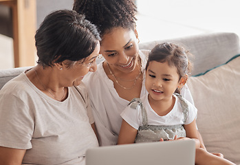 Image showing Children, family and laptop with a girl, mother and grandmother using the internet on a sofa in a living room. Adoption, foster care and love with a woman, daughter and child watching series together