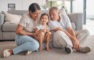 Image showing Grandparents, little girl and love in relaxing bonding time together in the living room at home. Portrait of happy child smiling in loving, fun relationship with grandma and grandpa relaxing on floor