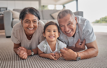 Image showing Relax, happy and grandparents with girl in living room with family from Indonesia for lifestyle, love and retirement. Care, smile and portrait of elderly man and old woman with child at home together