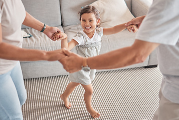 Image showing Happy family, child and playing circle game while bonding, fun and holding hands with energy, happiness and joy with energetic asian girl. Kid, play and support with man and woman doing dance at home