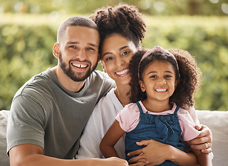 Image showing Happy family, mother and father with their child love being home for bonding, quality time and relaxing together. Smile, mom and dad enjoy hugging and connecting with their young girl on the weekend