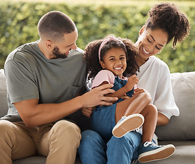 Image showing Child portrait, playing family and parents with love and smile for happy girl on living room sofa in house together. Comic mother, father and young kid being crazy on the couch in the lounge of home