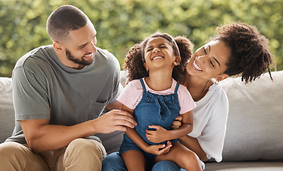 Image showing Love, relax and happy family laugh on sofa together for leisure in Mexico with caring parents. Mexican mother and father enjoy tickling game on couch with young daughter for bonding fun.