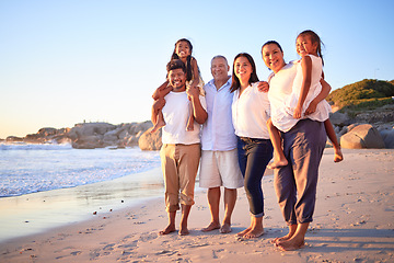 Image showing Travel, portrait and family at the beach at sunset, happy and relax while walking and bonding at the ocean together. Wellness, freedom and happy family enjoying a calm, relax walk on sea sand