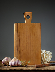 Image showing still life with cutting board and vegetables