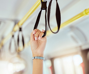 Image showing Public transport hands, safety handle and railing loop on bus, train and urban metro subway. Closeup woman traveler grab handrail support, handle and transportation ring in crowded cabin for journey