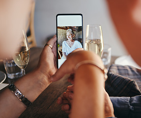 Image showing Phone, image and vacation memories with senior couple drinking champagne sitting at table at restaurant looking at picture gallery on social media. Happy senior woman on smartphone screen on holiday