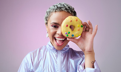 Image showing Black woman, donut and fashion excited and happy peeking through dessert with futuristic vaporwave and holographic style and purple background. Face portrait of cool and trendy African female model