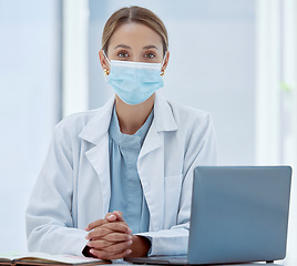 Image showing Covid, laptop telehealth and doctor face mask for healthcare, safety and insurance in medical clinic. Portrait woman, wellness expert and therapist consulting online in corona virus pandemic hospital