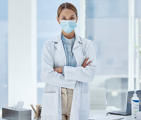 Image showing Covid, face mask and woman doctor with trust, insurance help and protection to stop spread of global virus in hospital. Portrait, medical worker and healthcare employee in covid 19 safety compliance