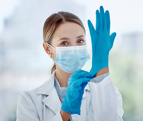 Image showing Covid woman doctor, face mask and gloves safety, medicine and risk in medical hospital, laboratory and clinic. Portrait corona virus nurse, healthcare expert and professional therapist ready in ppe