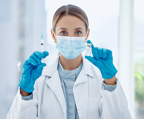 Image showing Doctor, mask and needle with vaccine for covid in bottle at hospital, for health and community safety. Woman, medic and injection in lab to research for stop coronavirus, syringe, medicine or cure