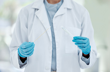 Image showing Healthcare, hand and doctor with covid test in a hospital, hands holding pcr test and swab. Research, health and innovation closeup of nurse doing analysis of corona testing results medical sample