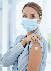 Image showing Woman with plaster on arm from covid vaccine and mask, medical injection and corona virus for immune system, wellness and clinic healthcare. Female patient with flu vaccination, treatment and risk
