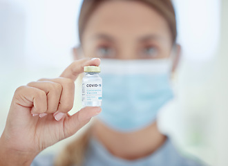 Image showing Woman doctor, hands and covid vaccine bottle in medical, wellness treatment or healthcare hospital compliance. Medicine zoom, worker or consulting employee and global covid 19 virus pharmacy solution