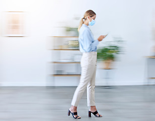 Image showing Covid mask in office, woman walking with phone doing business in fast pace workplace with protection and typing email. Professional employee safety in corona virus, company healthcare and busy blur