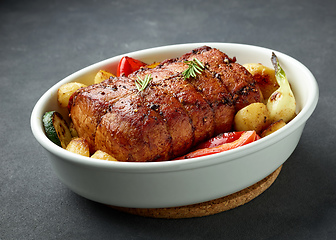 Image showing whole roast pork and vegetables
