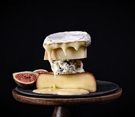 Image showing stack of various cheese pieces