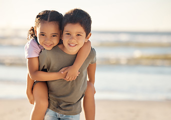 Image showing Portrait of boy and girl at the beach during family summer vacation during sunset. Happy children or sibling hug, play and smile at the ocean or sea with freedom, care and smile on nature holiday