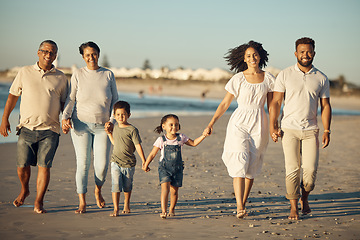 Image showing Family on beach with children smile while parents, kids grandparents holding hands on vacation by the ocean. Black family walking in sand by the sea, show love and bonding on holiday or reunion