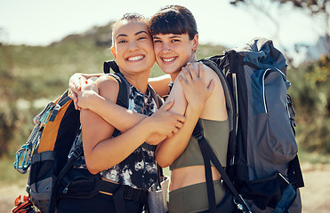 Image showing Women mountain hiking, friends hug in nature and outside in summer sun freedom. An adventure hike is great for exercise, fitness training and cardio with friend on hills of a local natural landscape