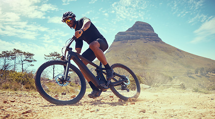 Image showing Mountain bike, fitness and exercise man off road, dirt road or sand by Lions head mountain. Health, wellness and male on desert, dust or terrain track on bicycle training for cycling race in nature.