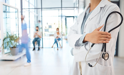 Image showing Medical healthcare doctor, woman worker or employee arms crossed confident with stethoscope in busy hospital. Leadership, work or wellness female staff manager nurse working in medicine clinic office