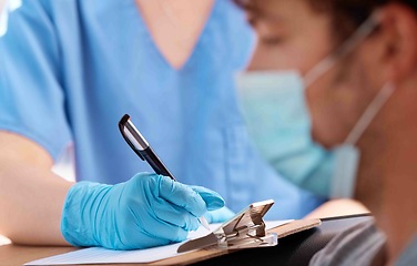 Image showing Checklist, covid face mask of patient in doctor consultation for healthcare insurance, safety and compliance with medical worker writing. Nurse consulting with sick man for corona virus clinic help