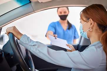 Image showing Covid test in car and drive thru, nurse giving patient forms to fill in. Woman in vehicle wearing a mask and taking documents from medical worker. Masks, coronavirus and testing on remote site