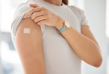 Image showing Covid, vaccine and woman with plaster on arm, medical shoulder injection dose and immunization bandage. Corona virus immunity, immune system cure or wellness and female patient healthcare vaccination