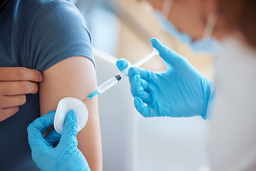 Image showing Medicine, health and patient with a covid vaccine from a doctor at a hospital during a pandemic. Closeup of a healthcare worker doing a medical antibody treatment injection at a medicare clinic.