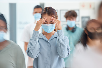 Image showing Covid, headache and business woman in mask in busy work environment, company office lobby or people crowd. Health, healthcare safety ppe or female burnout stress, sick or corona virus infection pain