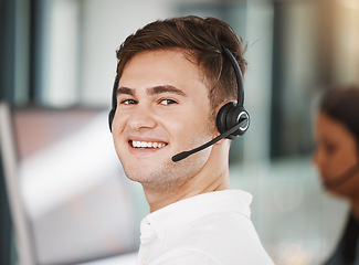 Image showing Portrait of a call center consultant working in an office doing a crm strategy with headset. Happy, professional and young telemarketing agent doing ecommerce sales and customer support operation.